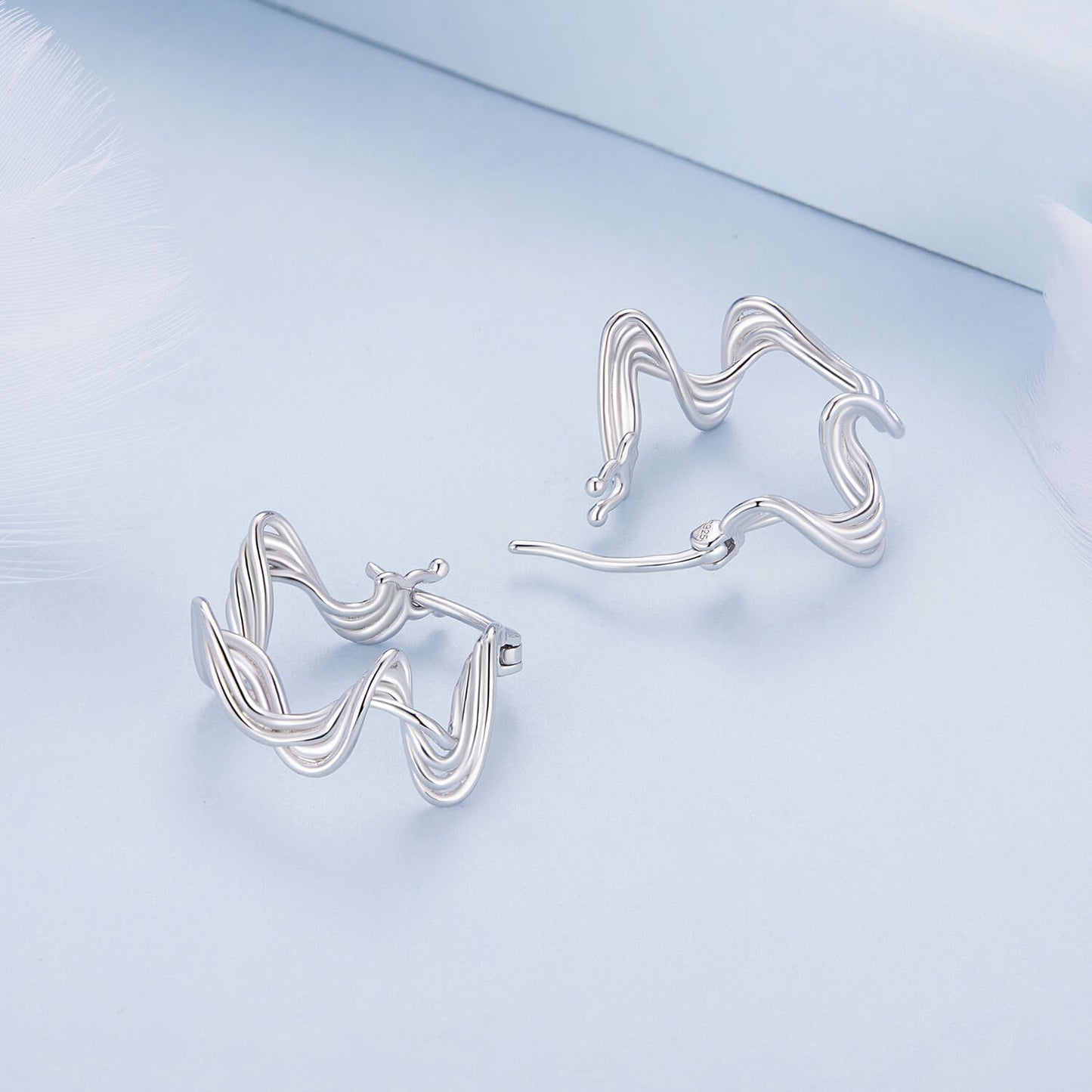 Wave Shaped Huggie Earrings in Sterling Silver sides