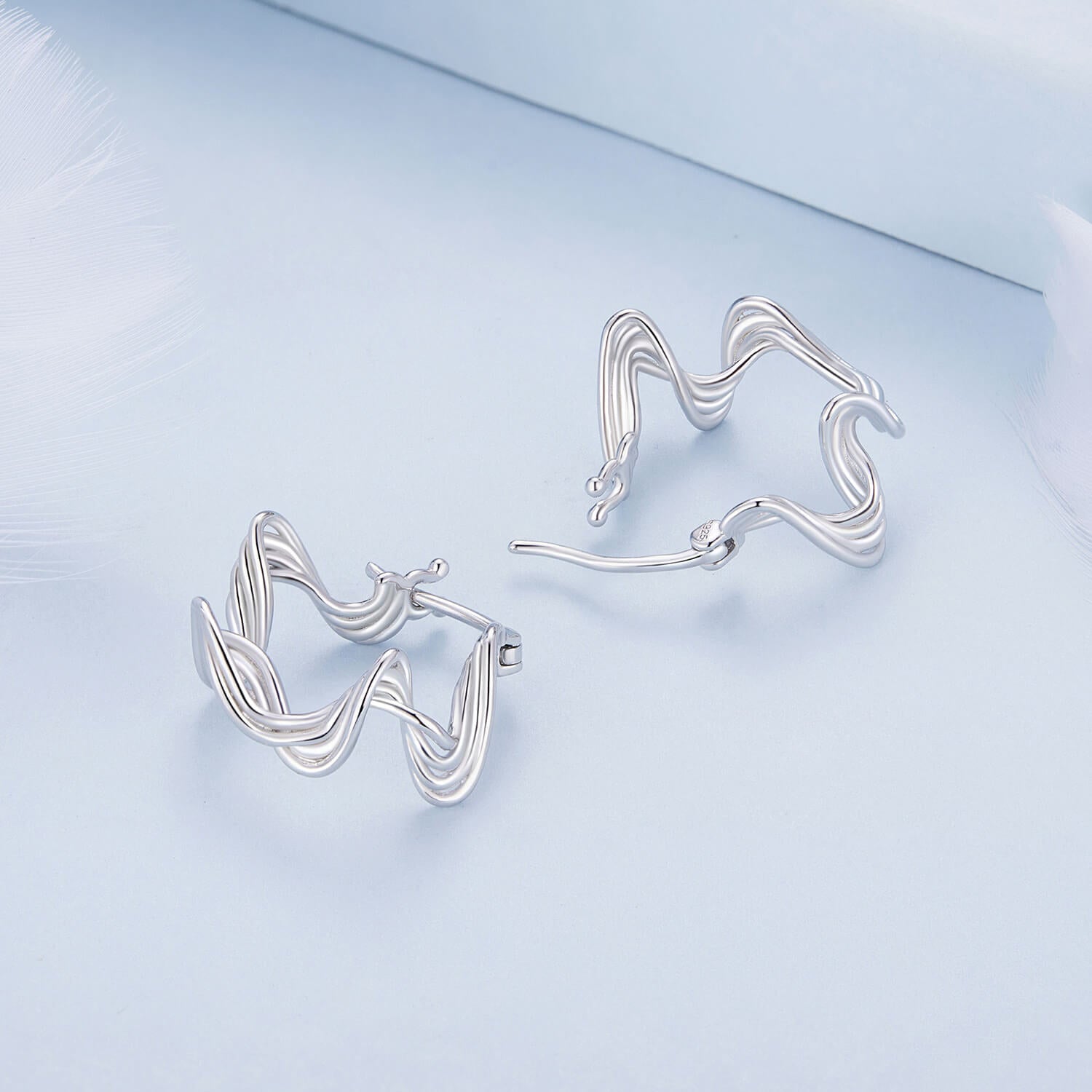 Wave Shaped Huggie Earrings in Sterling Silver sides