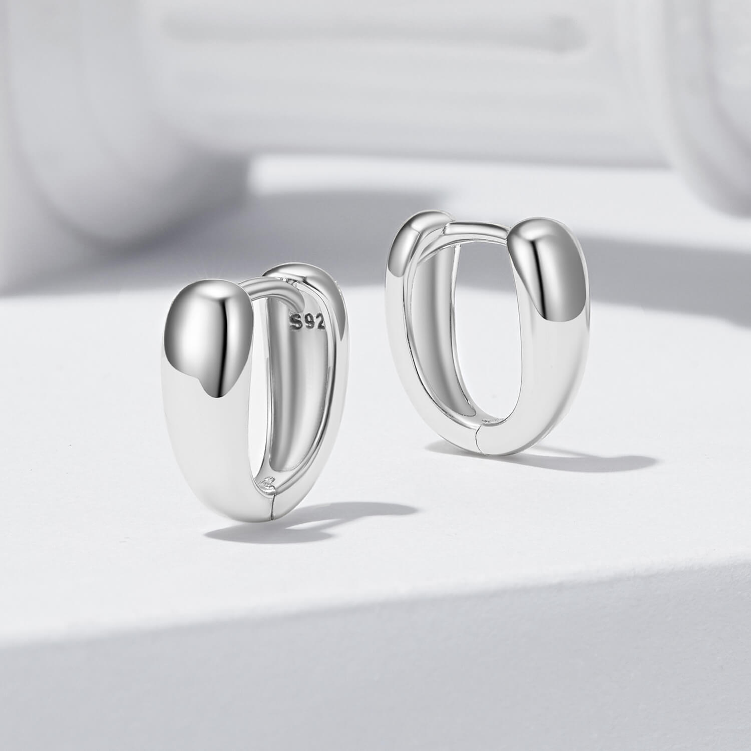 Minimalist Two-tone Twisted Huggie Earrings Set in Sterling Silver simple silver sides