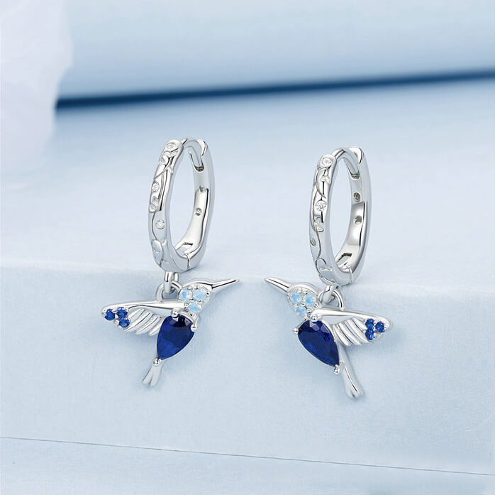 Elegant Blue Hummingbird Huggie Earrings in Sterling Silver - front