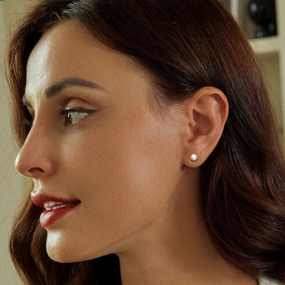 Round-cut Moissanite Stud Earrings in Silver with ball back - model wearing