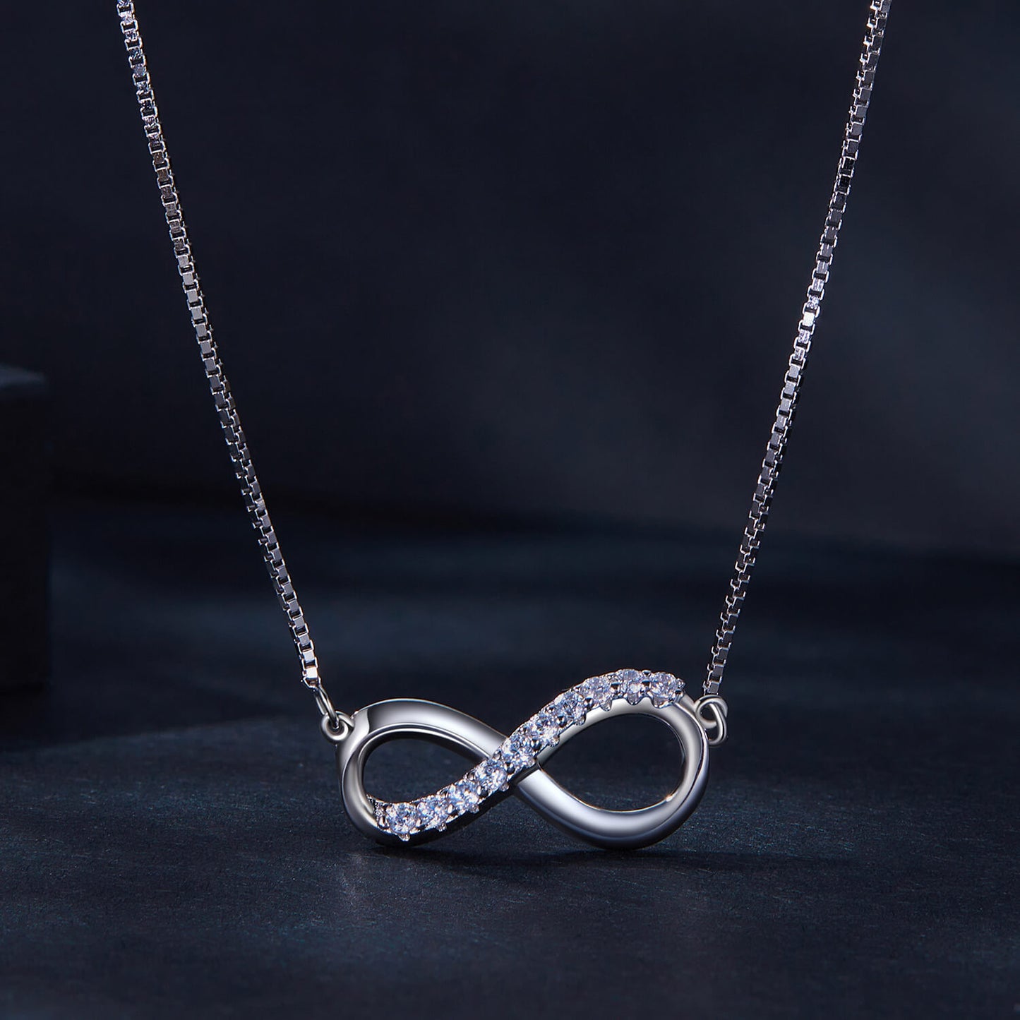 Infinity Mobius Strip Moissanite Necklace in Sterling Silver front