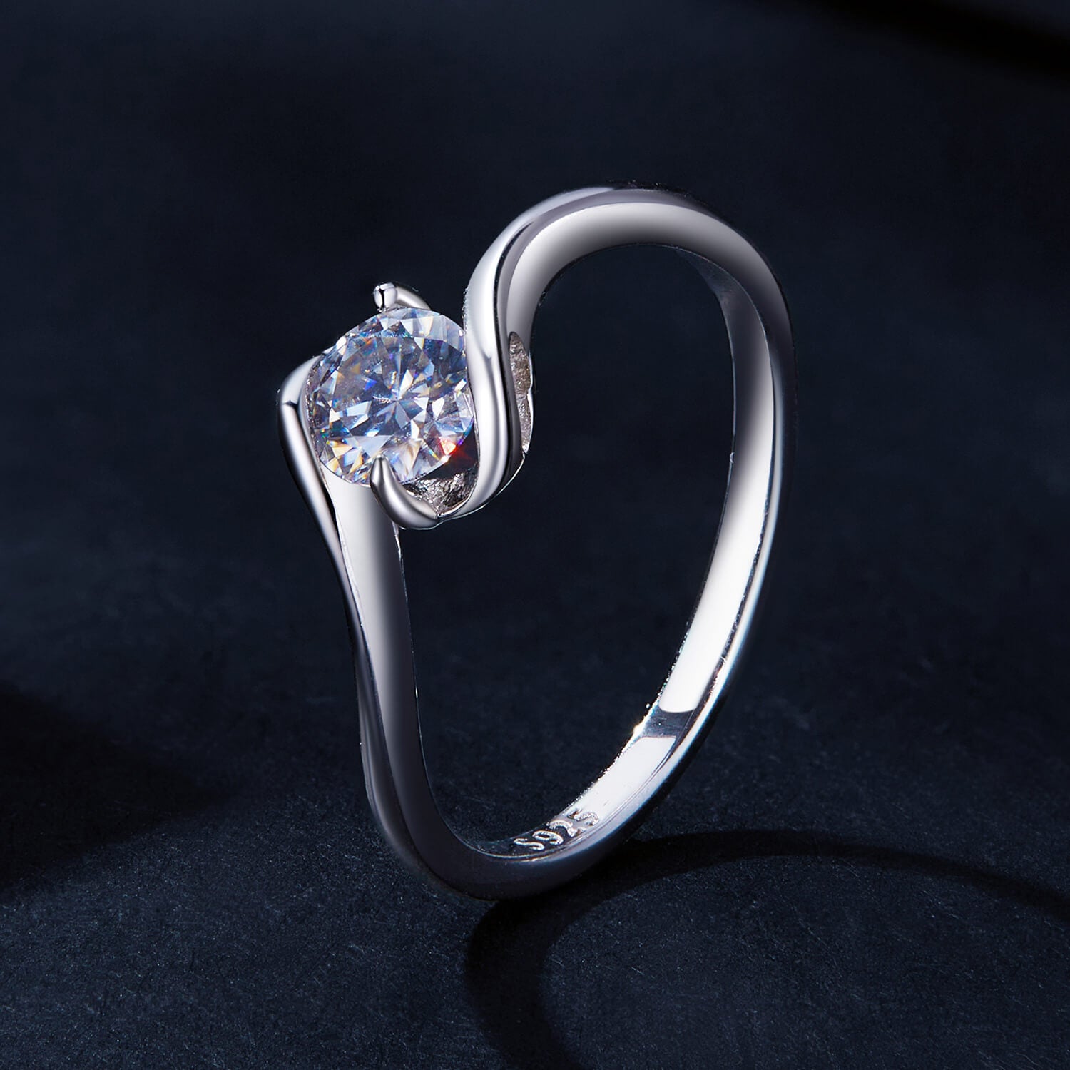 Solitaire Round Gem Moissanite Twisted Ring in Sterling Silver stand