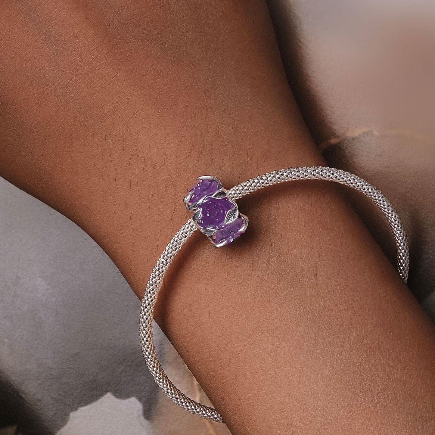 UV Color-changing Purple Rose Vine Resin Charm in Sterling Silver model after change