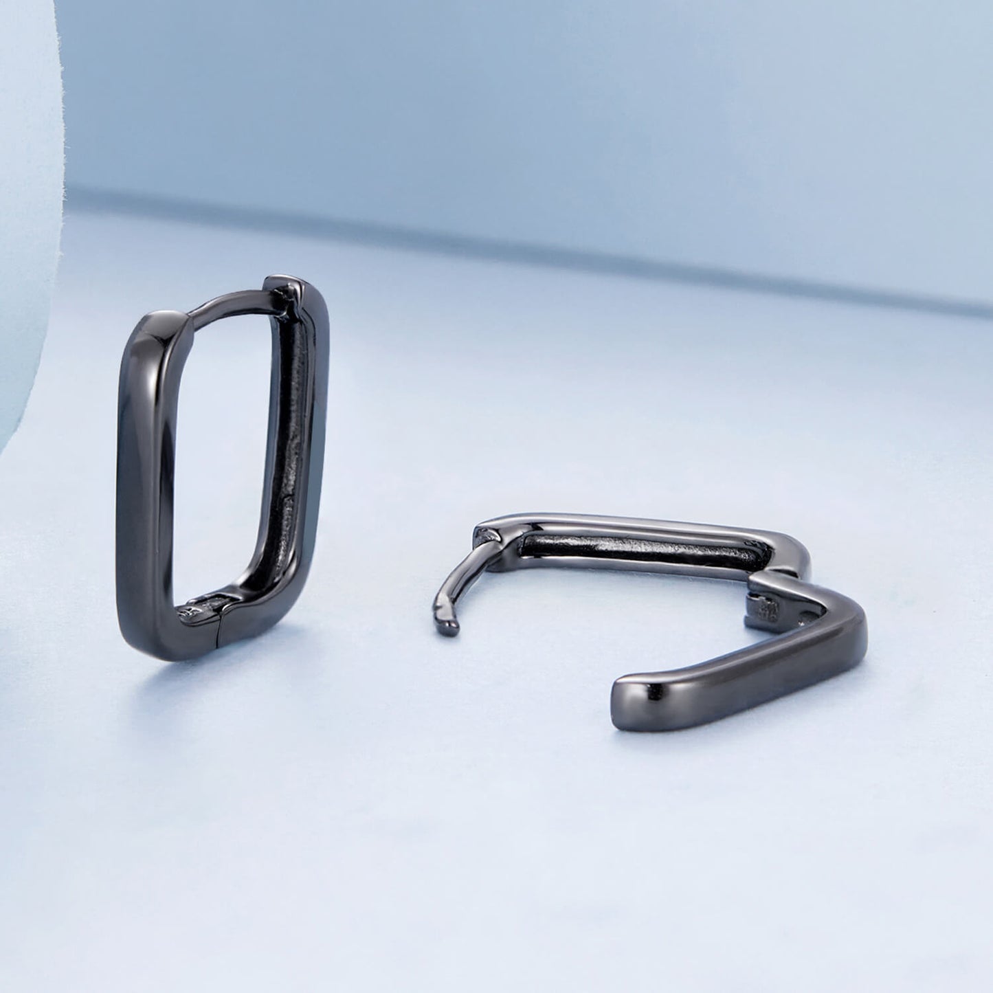 Black Ovate Huggie Earrings in Sterling Silver side