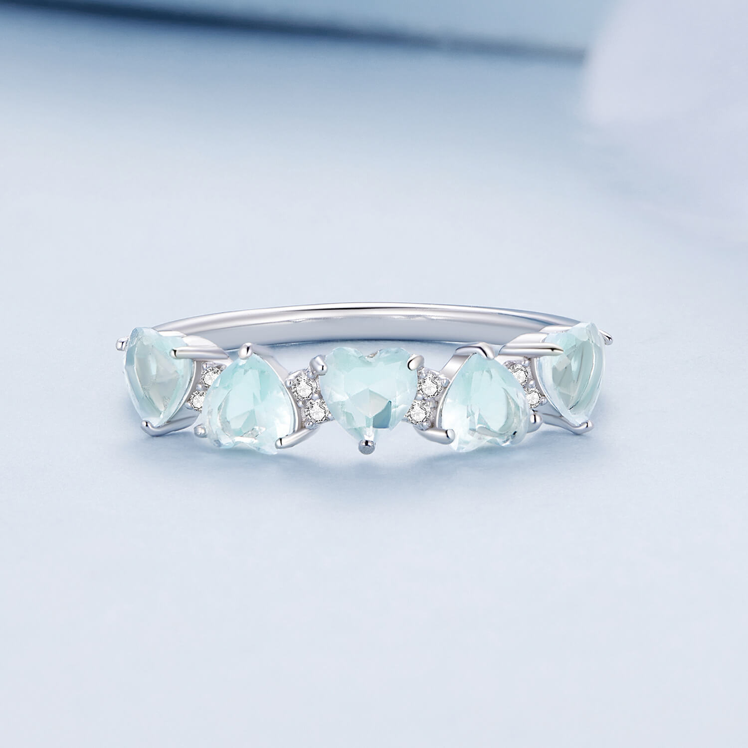 Heart Imitation Aquamarine Zircon Half Eternity Ring in Sterling Silver front